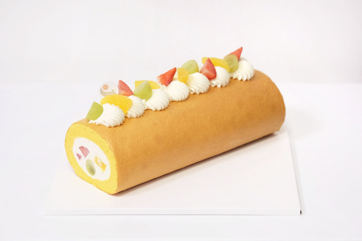A Japanese Roll Cake with light, airy sponge, rich creamy filling, and fresh seasonal fruits for a naturally sweet, vibrant, and refreshing dessert