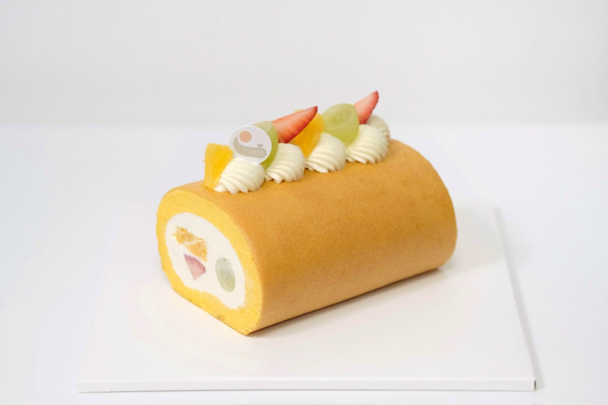 A Japanese Roll Cake with light, airy sponge, rich creamy filling, and fresh seasonal fruits for a naturally sweet, vibrant, and refreshing dessert