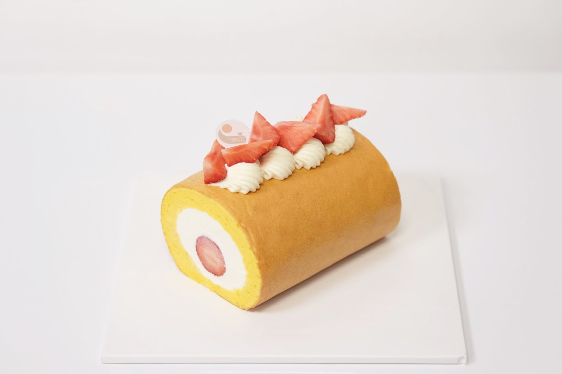 A fluffy Japanese Roll Cake with airy sponge, light cream, and fresh strawberries for a perfectly balanced, melt-in-your-mouth dessert
