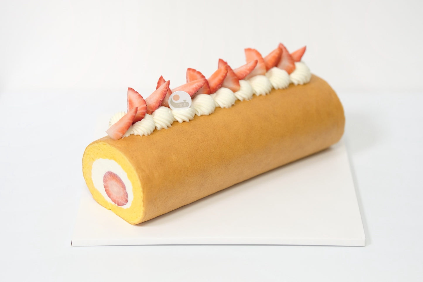A fluffy Japanese Roll Cake with airy sponge, light cream, and fresh strawberries for a perfectly balanced, melt-in-your-mouth dessert